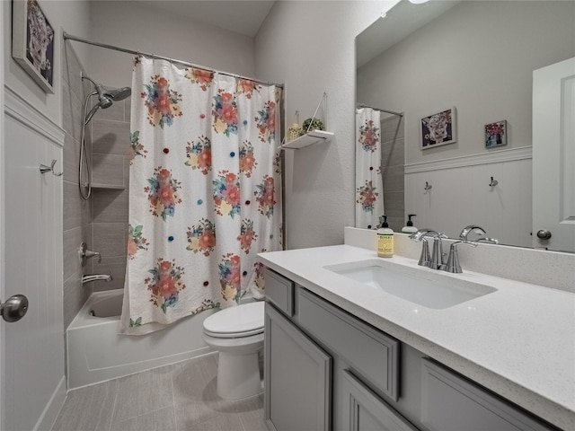 full bath with shower / bath combo, vanity, and toilet