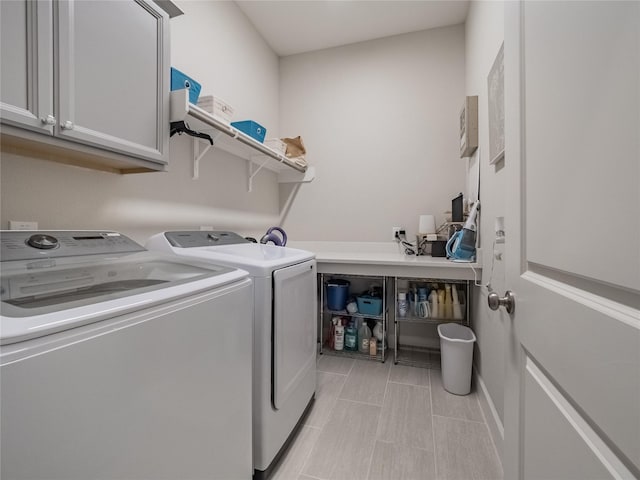 laundry area with cabinet space and washer and clothes dryer