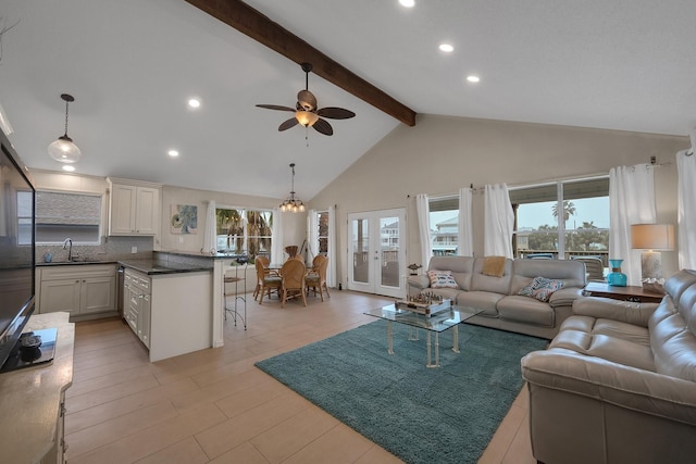 living room featuring high vaulted ceiling, french doors, beamed ceiling, and a wealth of natural light