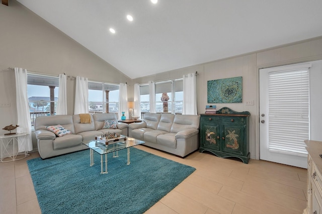 living area with recessed lighting, high vaulted ceiling, and light tile patterned flooring