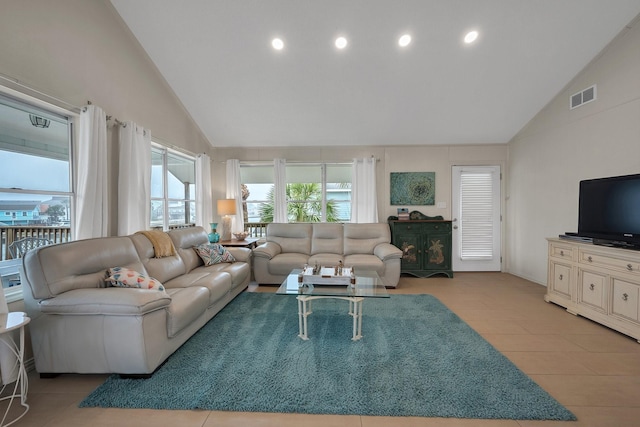 living room featuring high vaulted ceiling, visible vents, and recessed lighting