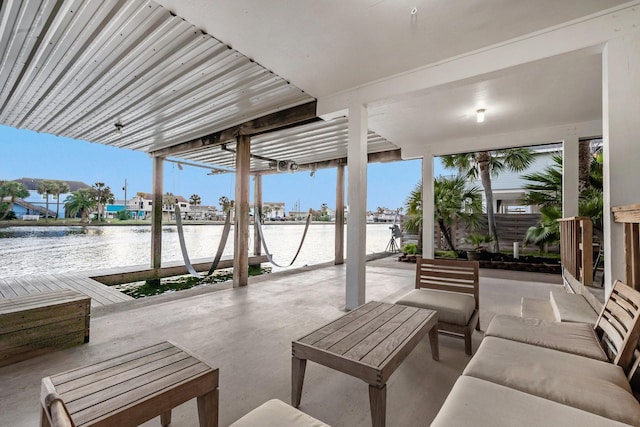 view of patio with a water view