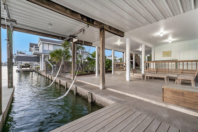 view of dock featuring a water view and boat lift