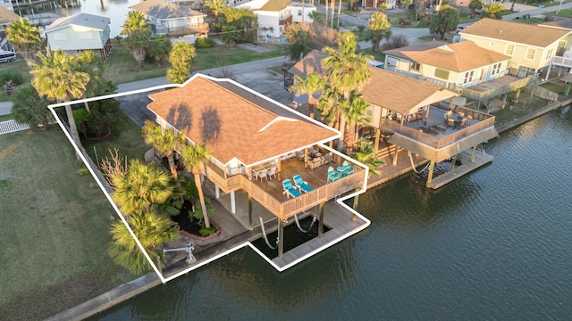 bird's eye view with a residential view and a water view