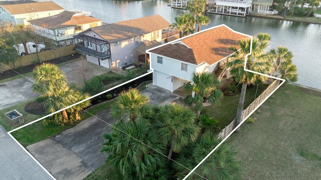 birds eye view of property with a water view