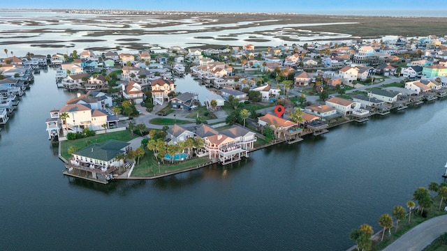 bird's eye view featuring a water view and a residential view