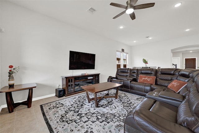 living room with visible vents, arched walkways, a ceiling fan, light tile patterned flooring, and recessed lighting