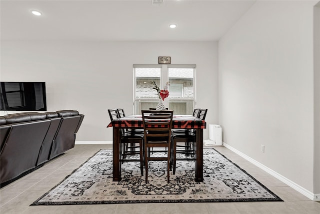 dining space with recessed lighting, light tile patterned flooring, and baseboards