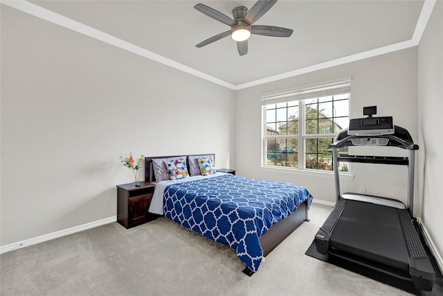 bedroom with ceiling fan, ornamental molding, carpet, and baseboards