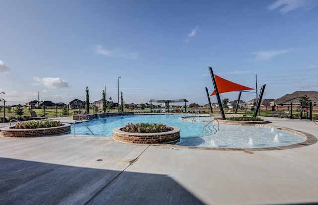 community pool with fence and a patio