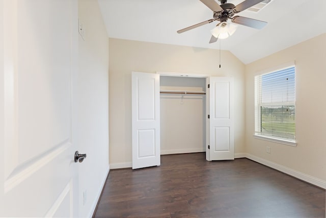 unfurnished bedroom featuring visible vents, dark wood-type flooring, a ceiling fan, vaulted ceiling, and baseboards