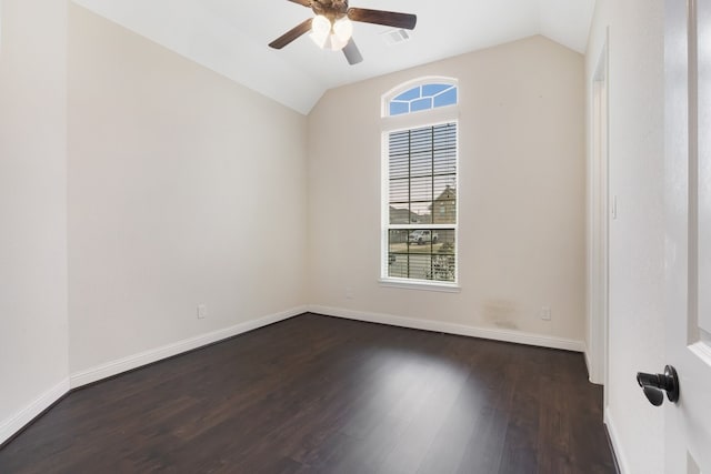 unfurnished room with lofted ceiling, wood finished floors, and baseboards