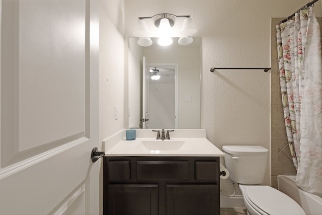 bathroom with toilet, a textured wall, shower / bath combo with shower curtain, and vanity