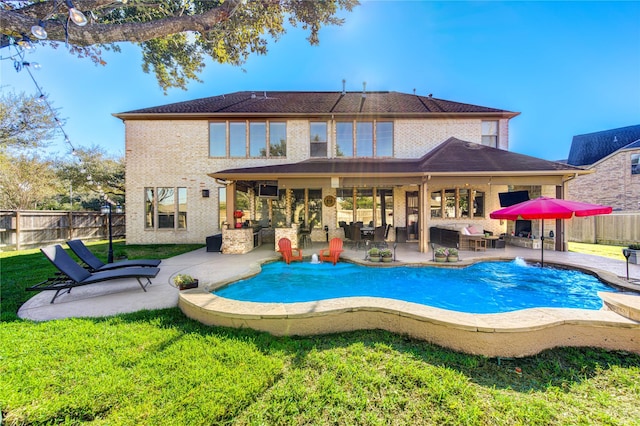 back of property featuring a fenced backyard, an outdoor living space, a patio, and a lawn