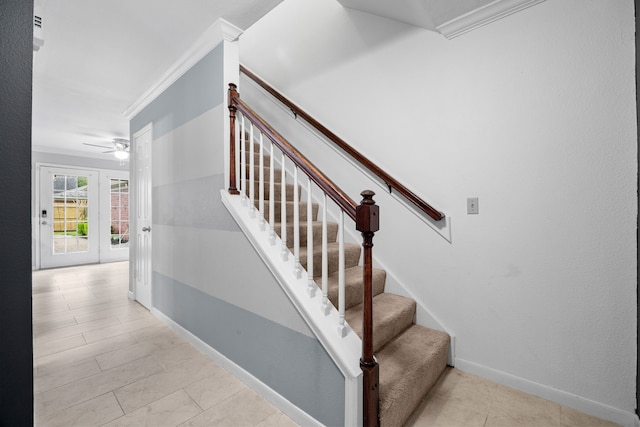 stairway with baseboards and crown molding