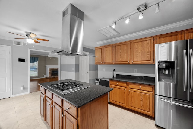 kitchen featuring appliances with stainless steel finishes, visible vents, island exhaust hood, and crown molding