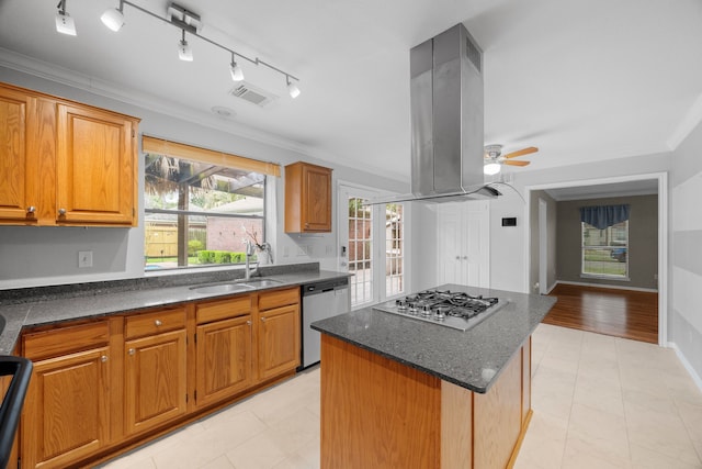 kitchen with a kitchen island, a sink, visible vents, appliances with stainless steel finishes, and island exhaust hood