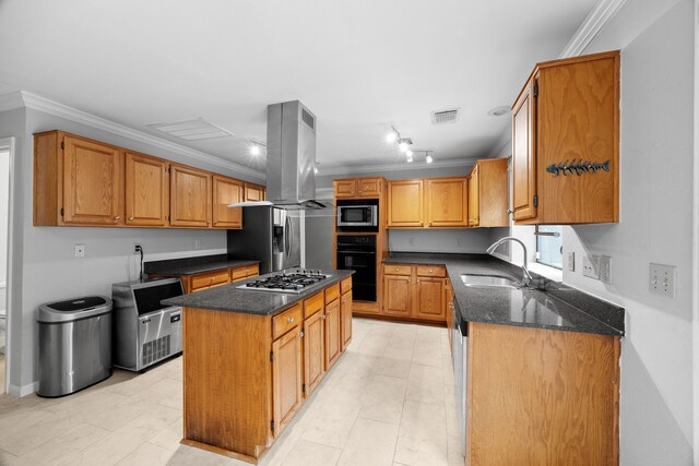 kitchen featuring island range hood, visible vents, a center island, stainless steel appliances, and a sink