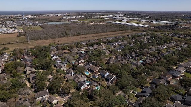 bird's eye view featuring a residential view and a water view