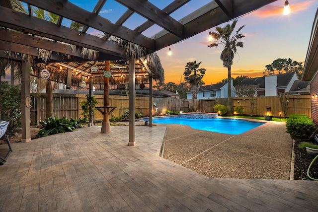 view of swimming pool with a fenced backyard, a fenced in pool, a pergola, and a patio