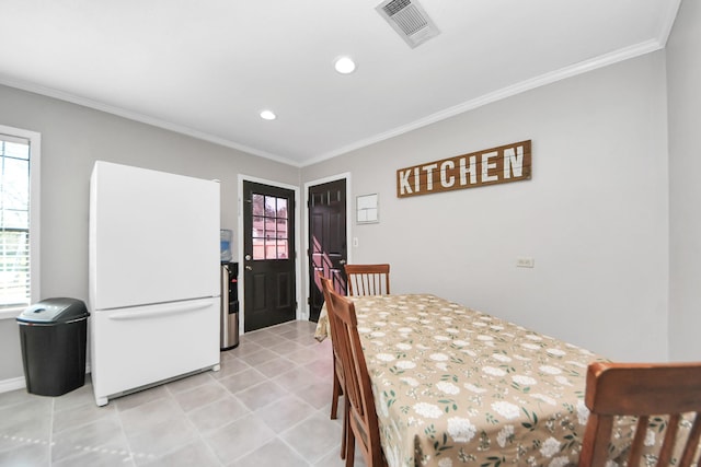 dining room featuring ornamental molding, visible vents, and recessed lighting