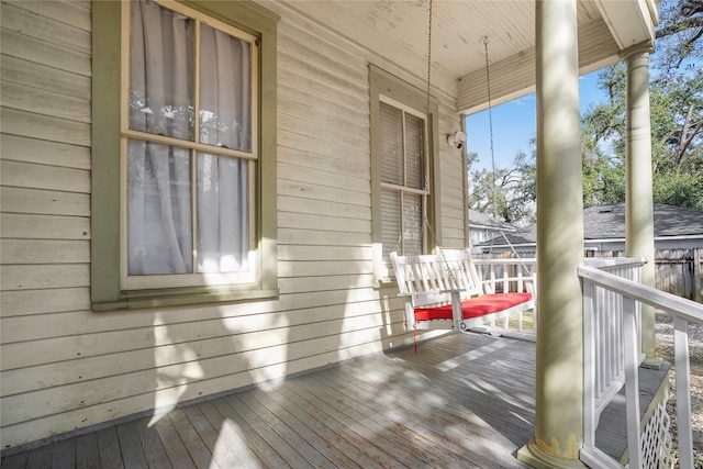 wooden deck featuring covered porch