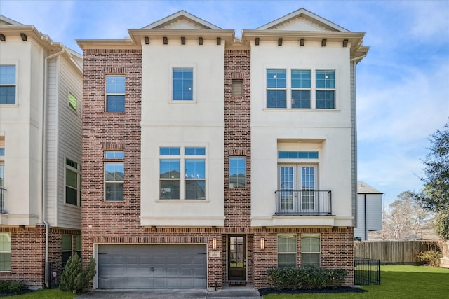 multi unit property featuring driveway, a garage, fence, a front lawn, and brick siding