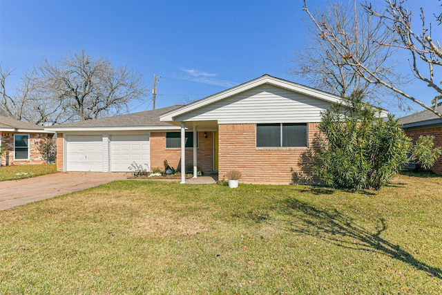 single story home featuring a garage, a front yard, brick siding, and driveway