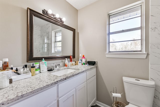 full bathroom featuring toilet and vanity