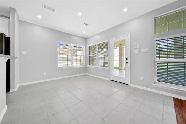 foyer entrance with recessed lighting, visible vents, baseboards, and light tile patterned floors