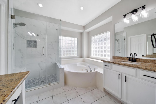 full bath featuring a marble finish shower, recessed lighting, vanity, a bath, and tile patterned floors