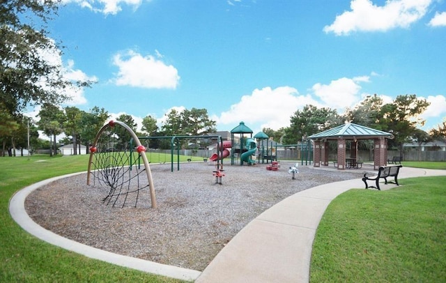 communal playground with a yard and a gazebo