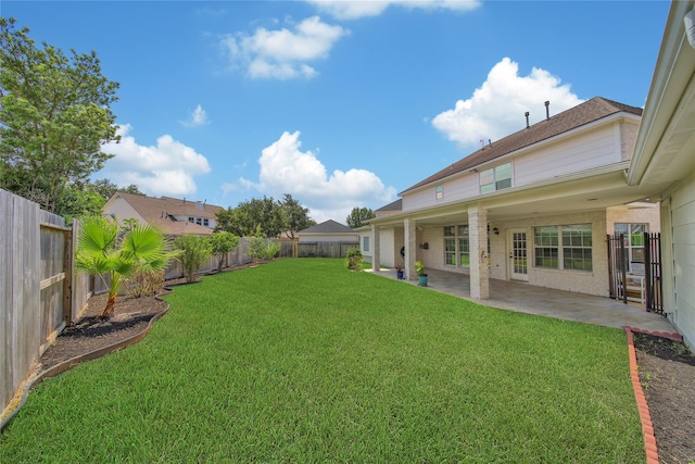 view of yard with a patio and a fenced backyard