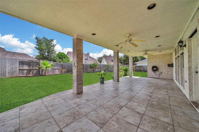 view of patio featuring a fenced backyard and ceiling fan