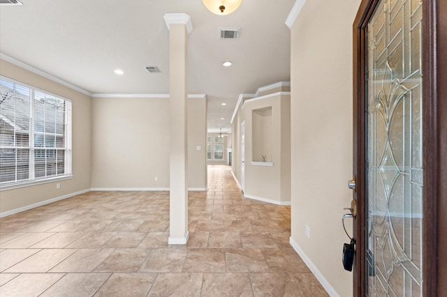 entrance foyer featuring baseboards, visible vents, crown molding, and recessed lighting