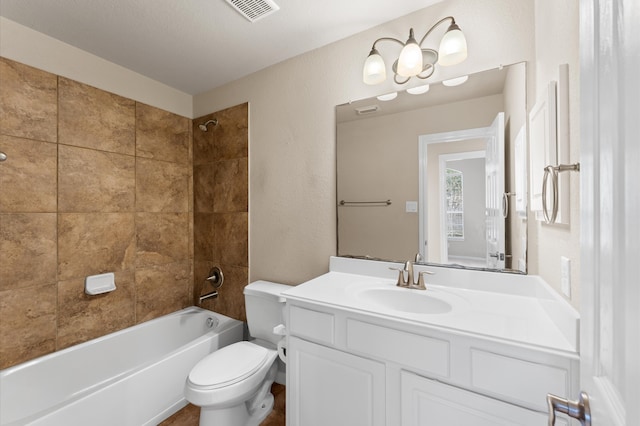 bathroom featuring toilet, vanity, shower / tub combination, and visible vents