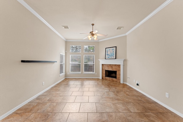 unfurnished living room featuring ceiling fan, visible vents, ornamental molding, and a tile fireplace