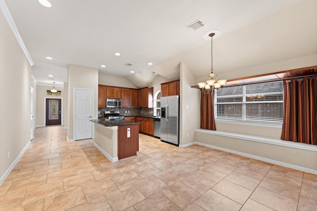 kitchen with a notable chandelier, tasteful backsplash, dark countertops, visible vents, and appliances with stainless steel finishes