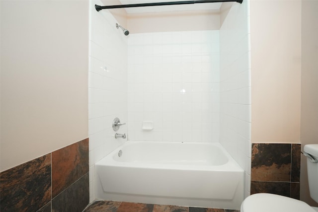 bathroom with shower / bath combination and toilet