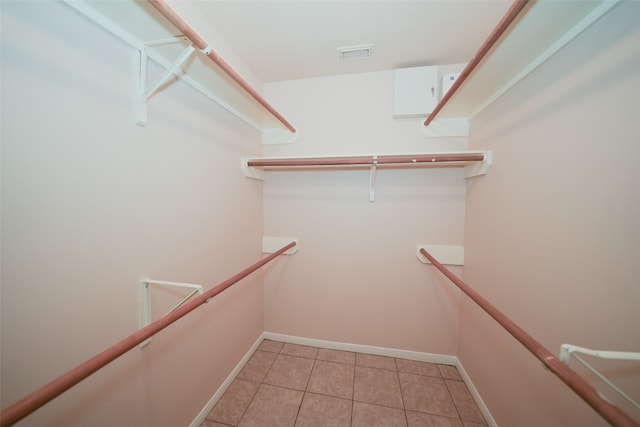 walk in closet with visible vents and light tile patterned flooring