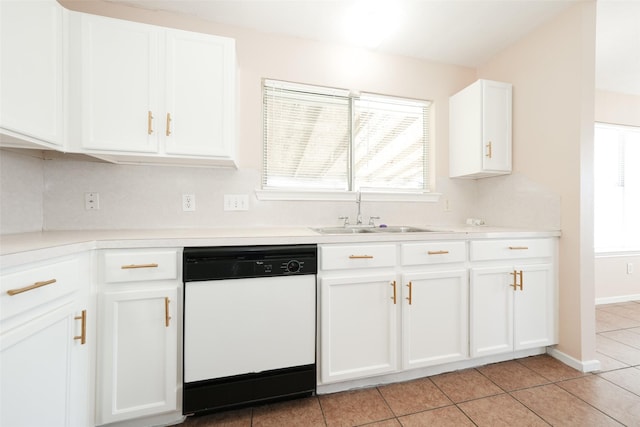 kitchen featuring light tile patterned floors, white dishwasher, a sink, white cabinets, and light countertops