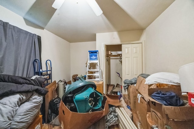 bedroom with vaulted ceiling, a closet, and a ceiling fan