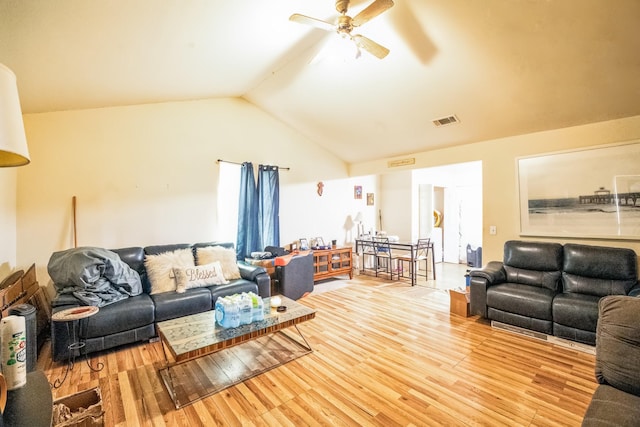 living area featuring light wood-type flooring, ceiling fan, visible vents, and lofted ceiling