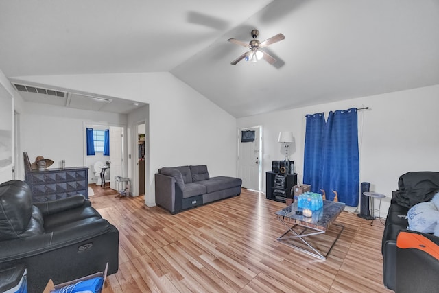 living room with light wood finished floors, attic access, visible vents, a ceiling fan, and lofted ceiling