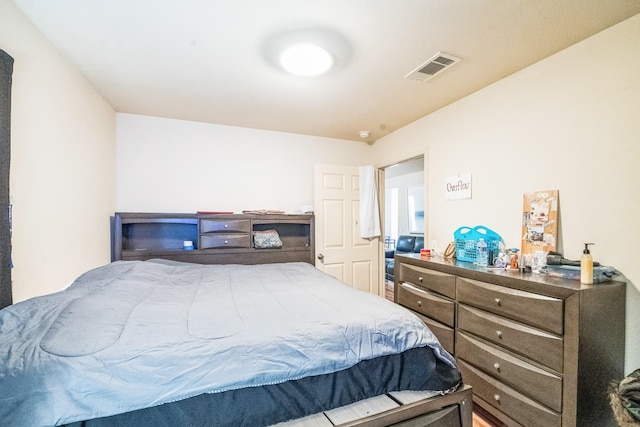 bedroom featuring visible vents