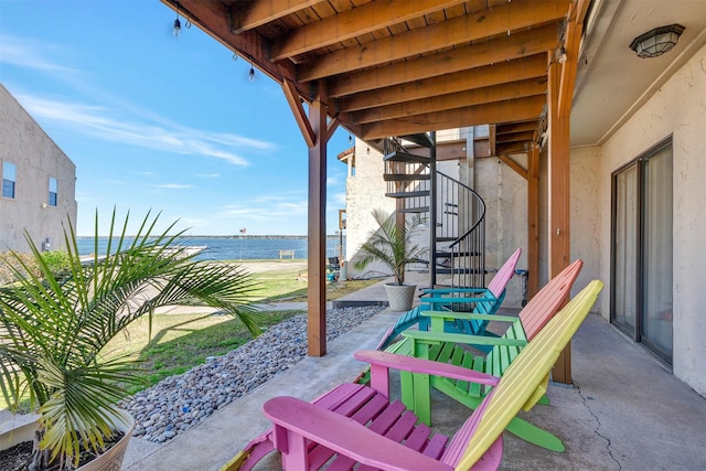 35 Regency Pt, Montgomery, TX 77356 - view of patio / terrace featuring a water view and stairway