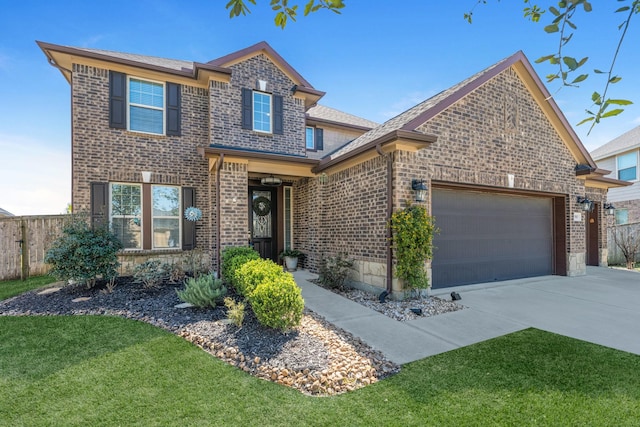 traditional-style house with an attached garage, brick siding, fence, concrete driveway, and a front yard