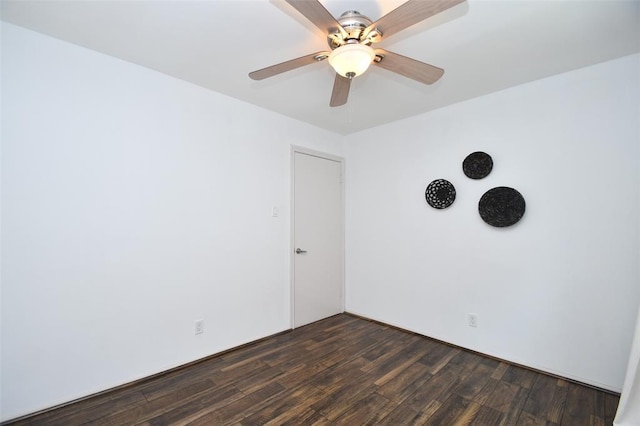 unfurnished room with dark wood-style flooring