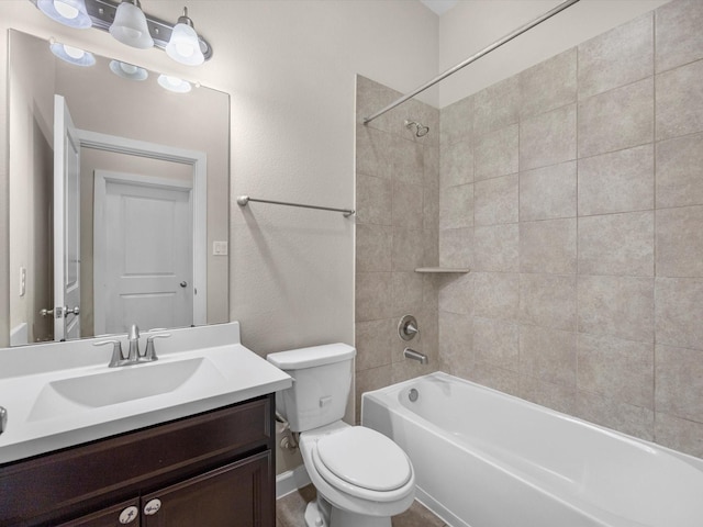 bathroom with shower / bath combination, vanity, and toilet