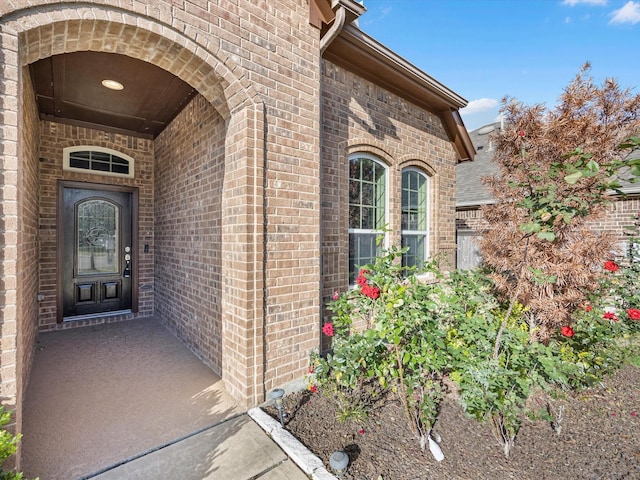 entrance to property with brick siding